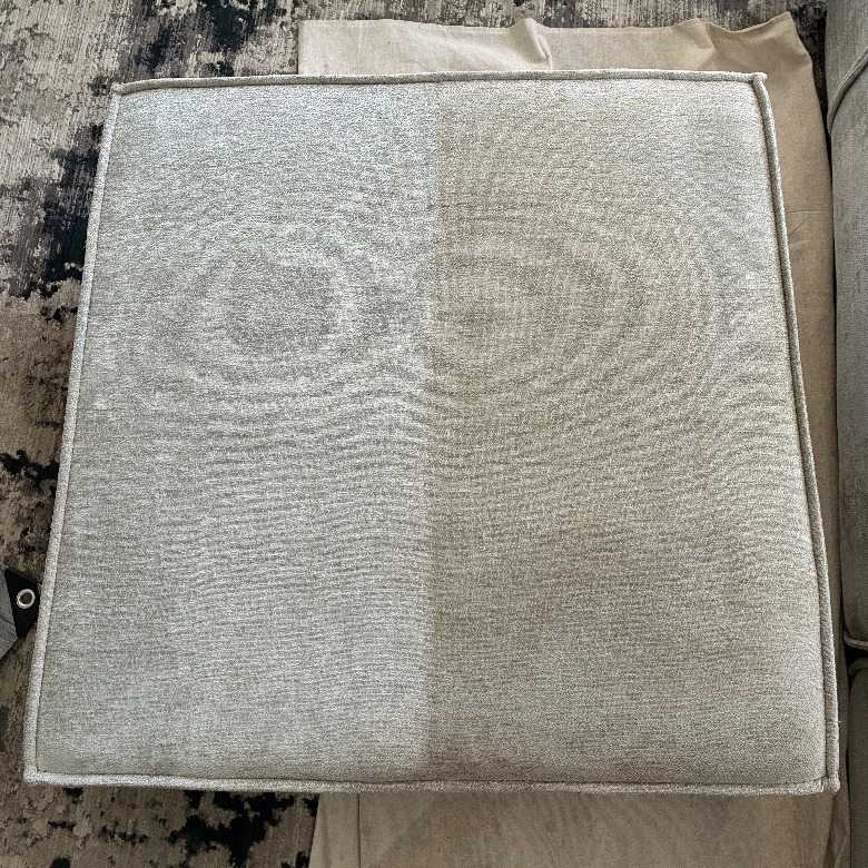 Upholstered seat cushion with the left half cleaned and the right half not yet cleaned